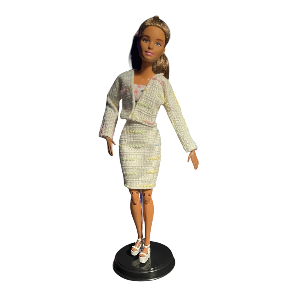 PartyDollFashionShop doll wearing an off-white textured tweed two-piece skirt suit with pastel accents and white heels.