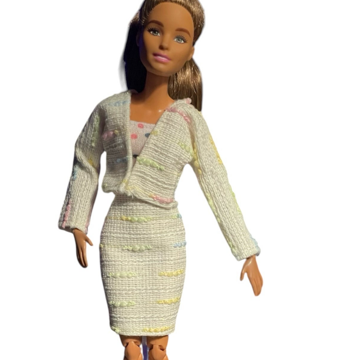 PartyDollFashionShop doll wearing an off-white textured tweed two-piece skirt suit with pastel accents and white heels.